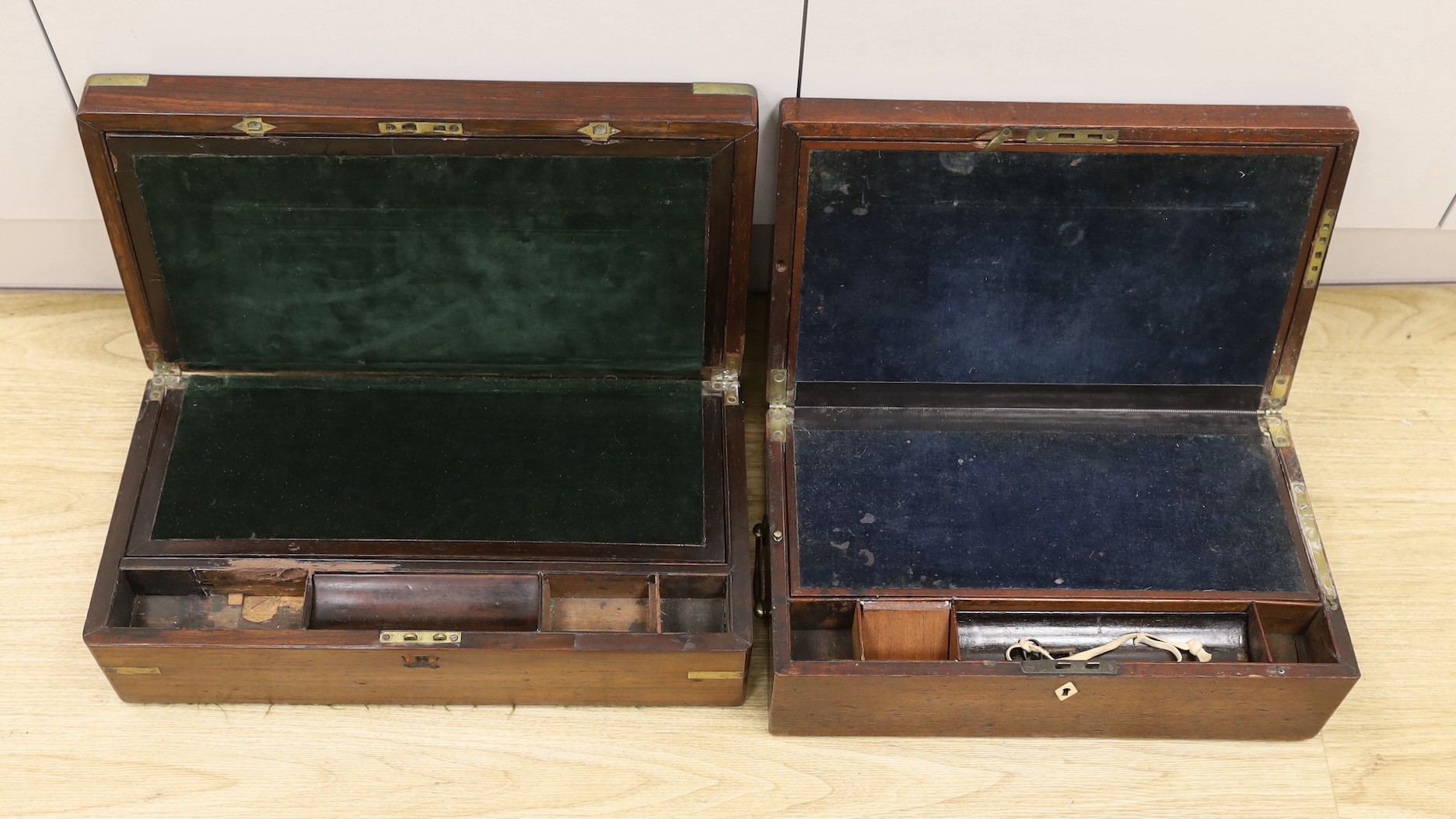 A Victorian brass bound mahogany writing slope together with another, largest 45cm